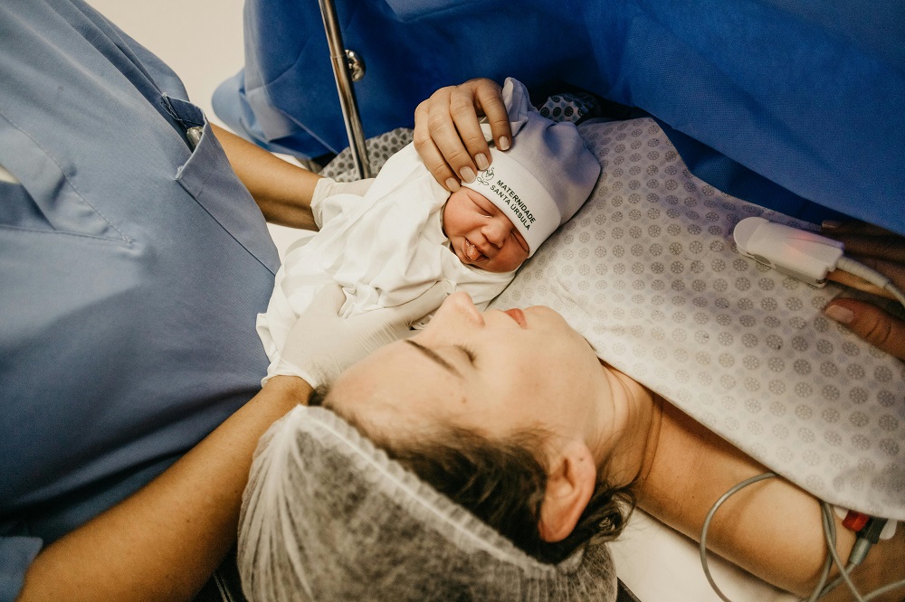 pediatric hospital room - newborn baby after spinal tap with mother and nurses